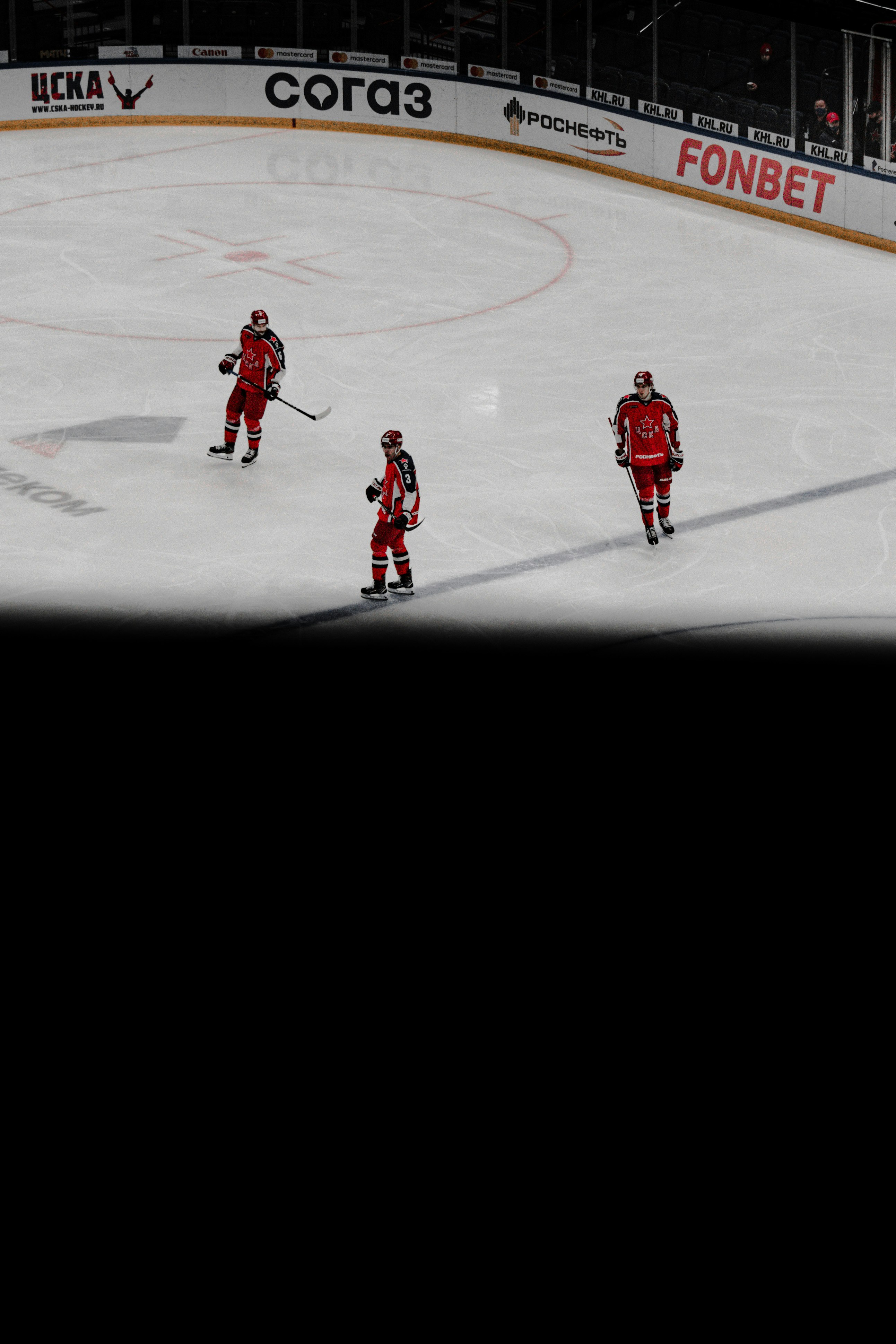 2 men in red and white ice hockey jersey